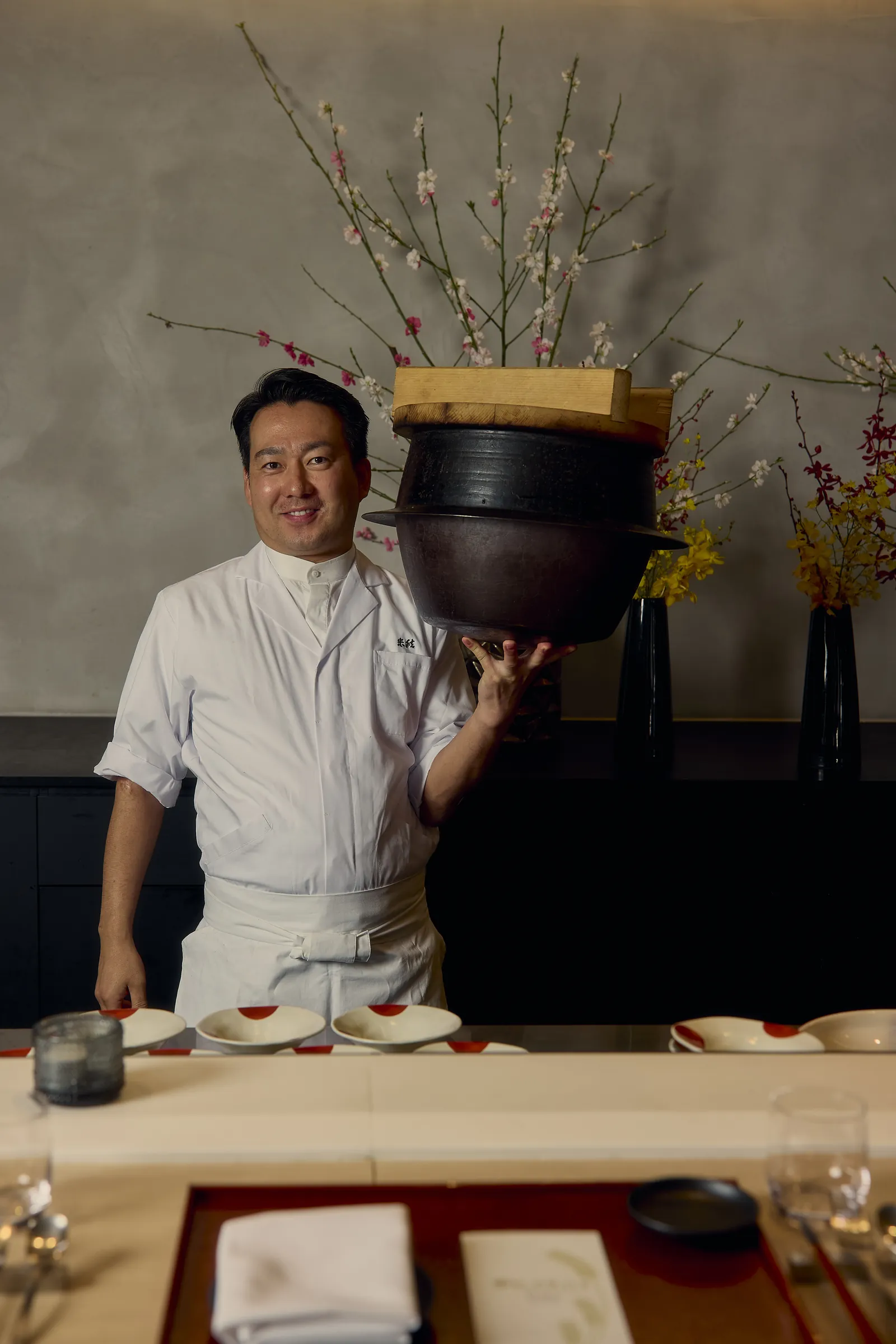 Owner and director Kuma with the hagama rice pot