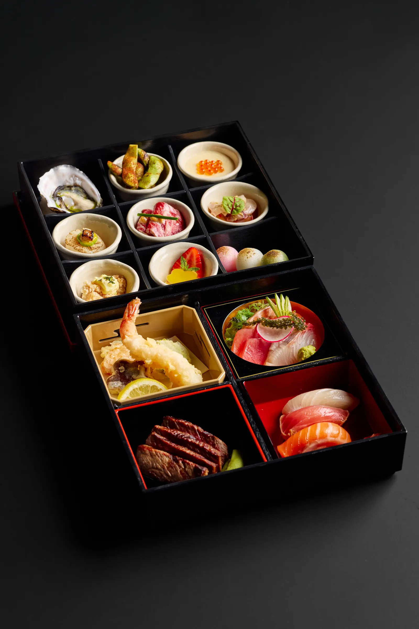 A Shokado bento box with sashimi, tempura and seasonal sides